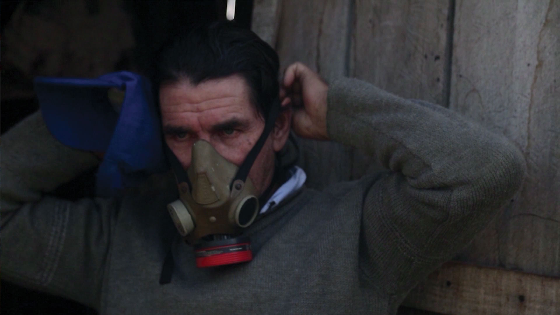Genetically Modified Children Argentina farmer puts on gas mask for pesticide and herbicide related health problems