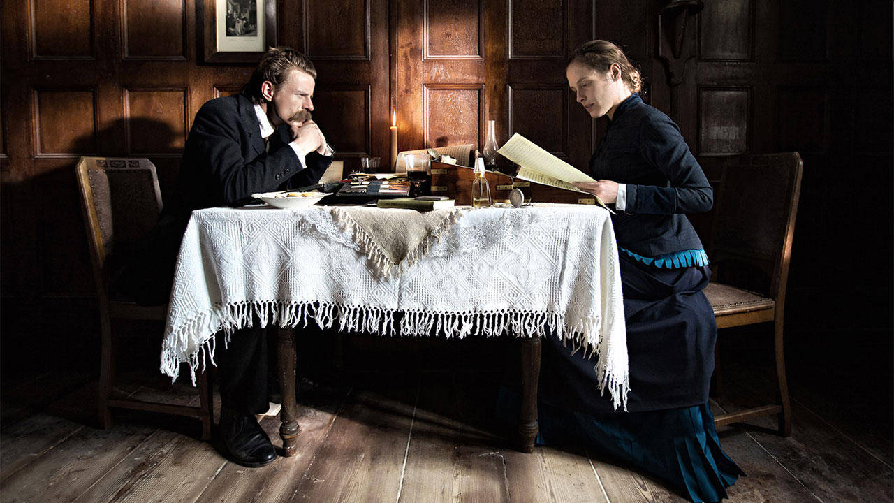 Lou Andreas Salome Nietzsche and Lou sit at table covered in psychology books studying psychoanalysis
