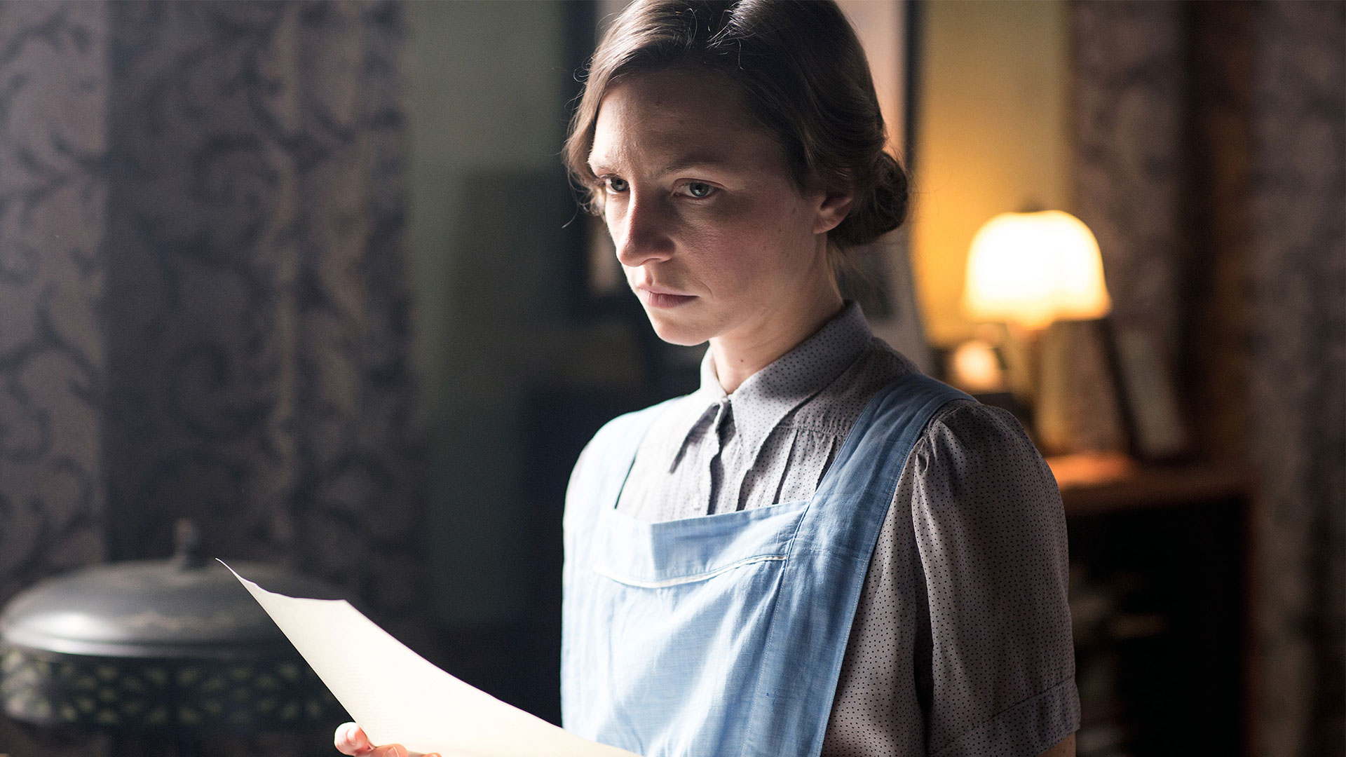 Lou Andreas Salome In Nazi Germany, Lou's caretaker holds a paper letter and looks concerned